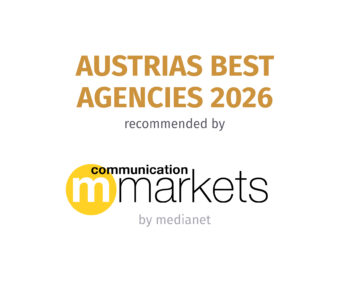 Textgrafik mit der Aufschrift &bdquo;AUSTRIAS BEST AGENCIES 2026 &ndash; empfohlen von communication markets by medianet&ldquo; in fetten goldenen und schwarzen Buchstaben, erg&auml;nzt durch einen gelben Kreis mit einem &bdquo;m&ldquo; darin.